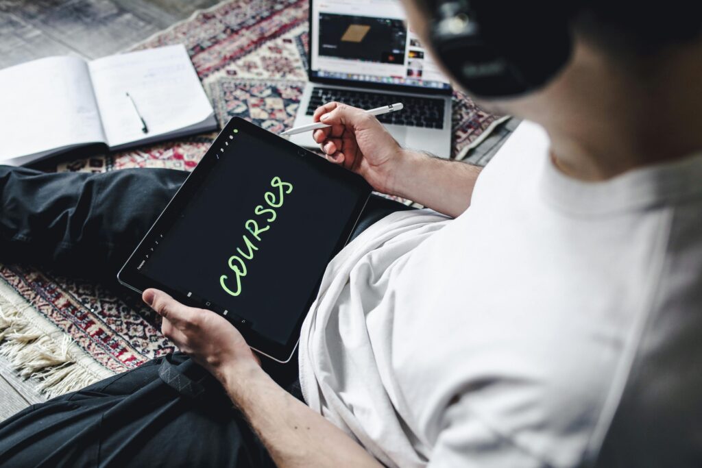 pexels photo 4443160 4443160 Person studying online courses using a digital tablet while relaxing indoors with headphones.